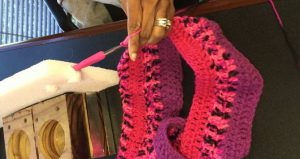 woman uses tool to crochet after stroke