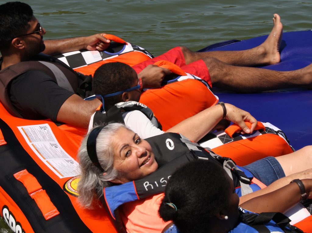 people rafting with rise adaptive sports group